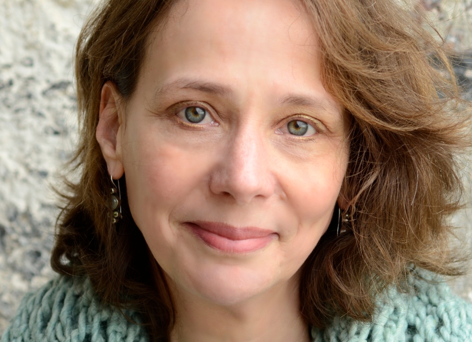Author photo of Meredith Miller, a woman with brown, shoulder-length hair and a pale green cardigan
